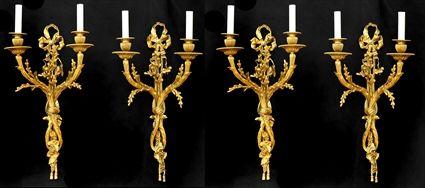 Appraisal: SET OF FOUR LOUIS XVI-STYLE GILT-BRONZE TWO-LIGHT WALL APPLIQUES Each