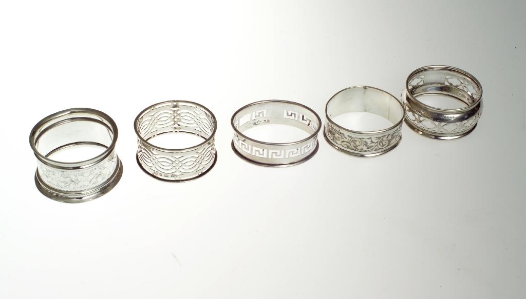 Appraisal: GROUP OF FIVE VICTORIAN AND LATER SILVER NAPKIN RINGS and