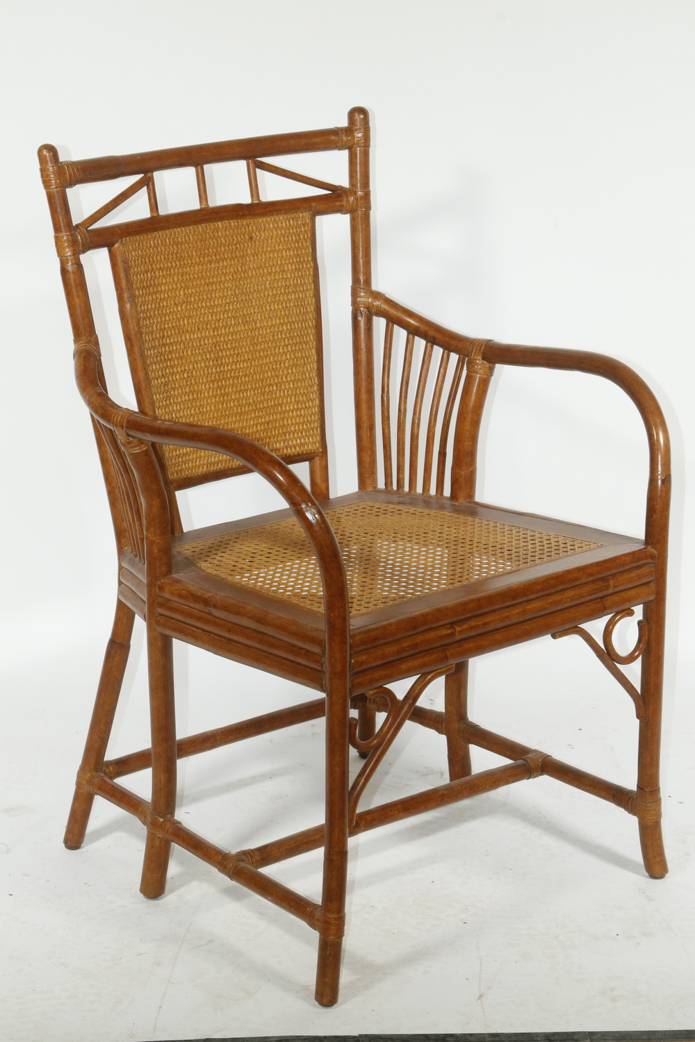 Appraisal: ARMCHAIR WITH CANED SEAT Faux bamboo armchair with caned seat