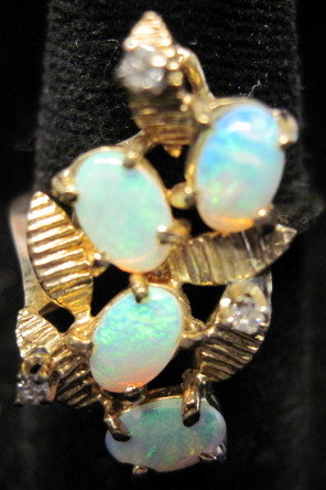 Appraisal: karat yellow gold opal and diamond ring Abstract form textured