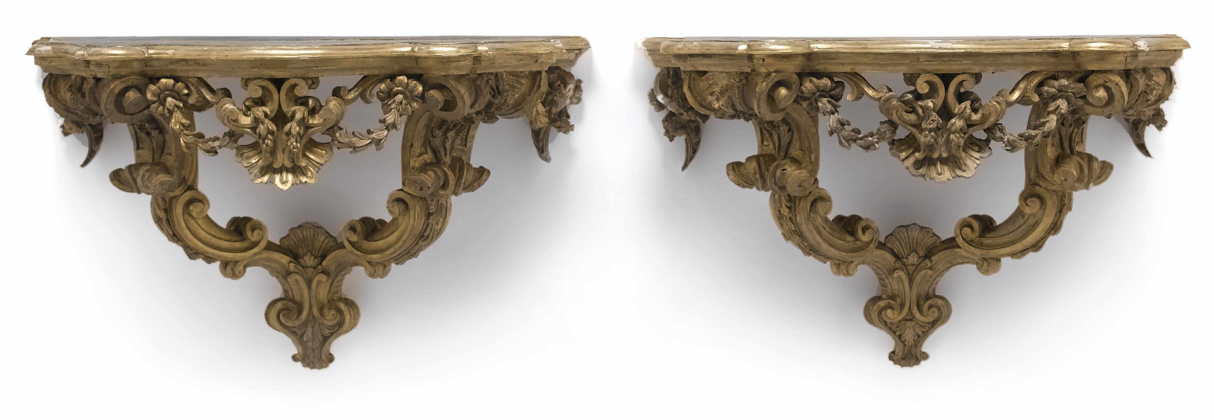 Appraisal: A pair of Italian Rococo carved giltwood consoles mid th