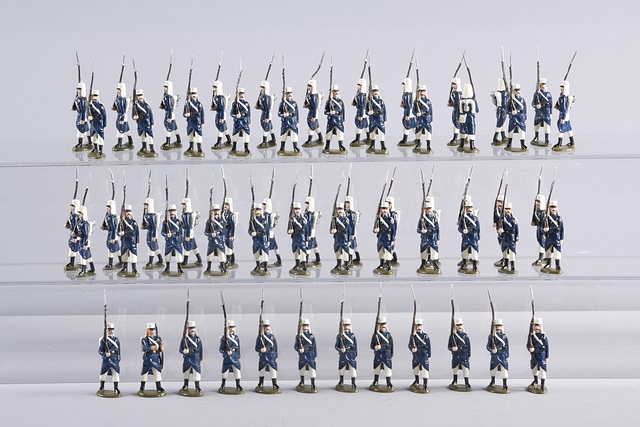 Appraisal: Lot of metal figures representing French Foreign Legion marching at