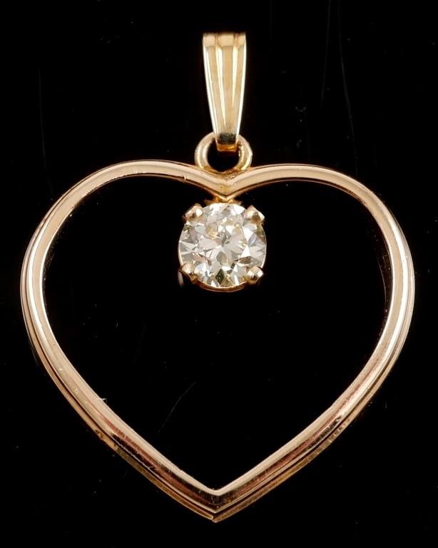 Appraisal: K DIAMOND HEART PENDANT K yellow gold pendant contains round