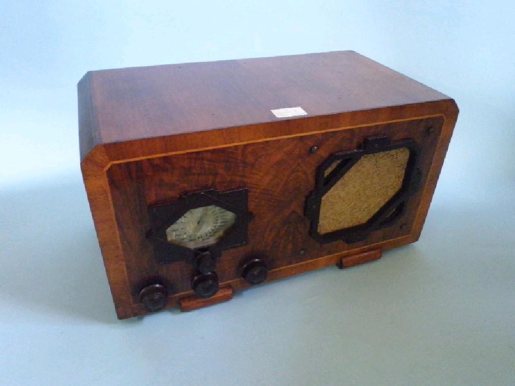 Appraisal: A Vulcan radio in a walnut case with bakelite fittings