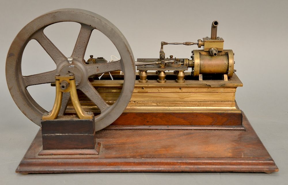 Appraisal: Early horizontal brass one cylinder steam engine with iron ''