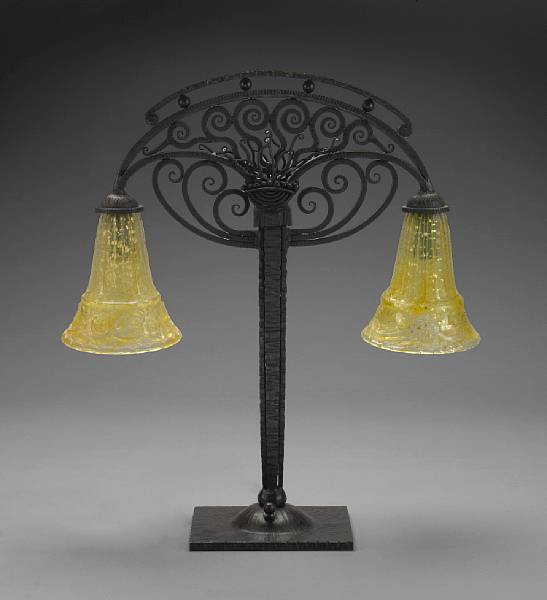 Appraisal: A French Art Deco wrought iron and Daum glass two