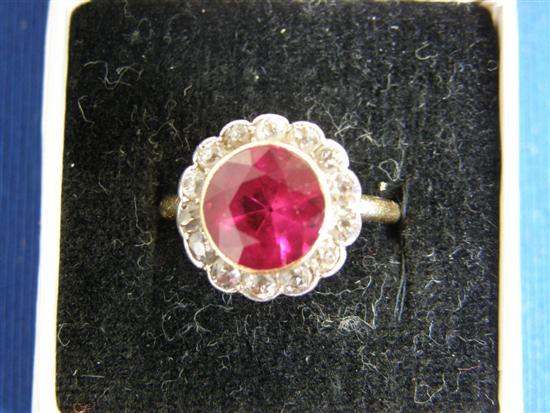 Appraisal: Cluster ring comprising a centre ruby testing as synthetic surrounded