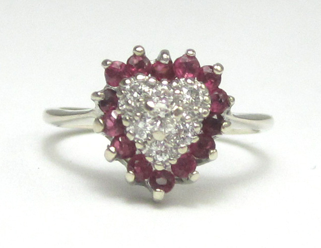 Appraisal: DIAMOND RUBY AND FOURTEEN KARAT GOLD RING The white gold