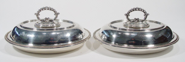 Appraisal: Pair of oval silver plated entr e dishes and covers