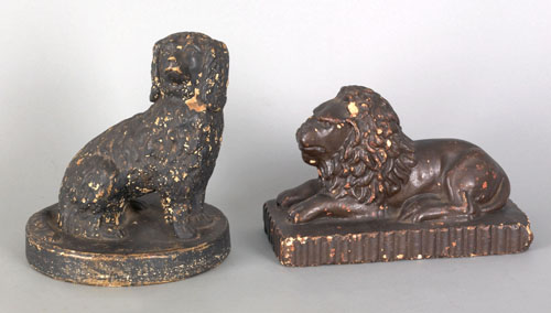 Appraisal: Two pottery figures of a recumbent lion and spaniel th