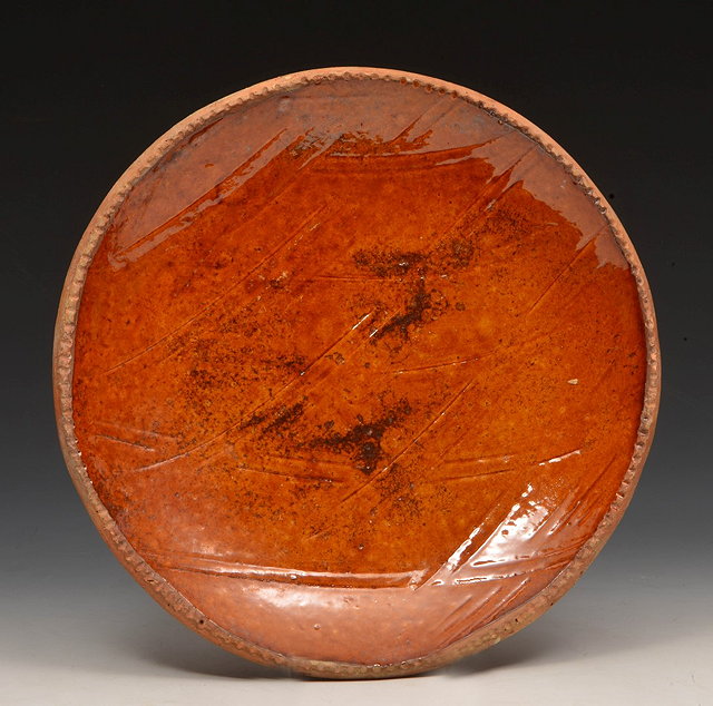 Appraisal: Leach PotteryDish probably attributable to Bernard Leachearthenware with treacle glaze