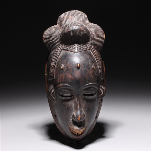 Appraisal: Carved wooden tribal mask from the Ivory Coast of West