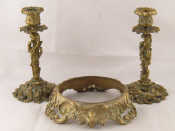 Appraisal: A pair of gilt brass candlesticks in the form of