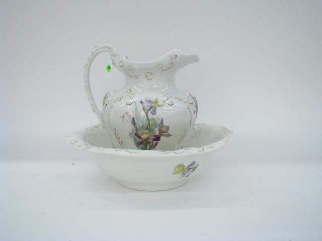 Appraisal: An antique porcelain pitcher and bowl set with painted floral