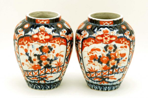 Appraisal: A pair of Japanese Imari jars Fluted baluster form with