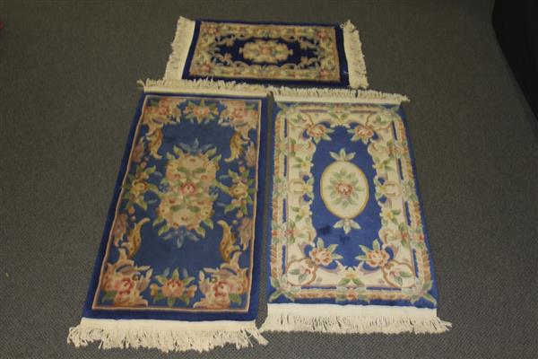 Appraisal: Three Chinese hand knotted Tientsin blue ground estate rugs carpets