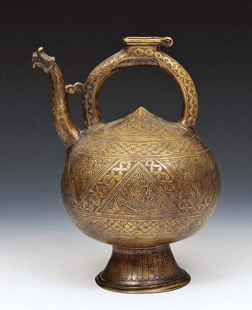 Appraisal: AN INDIAN PESIAN EWER with engraved onion shaped body stylised