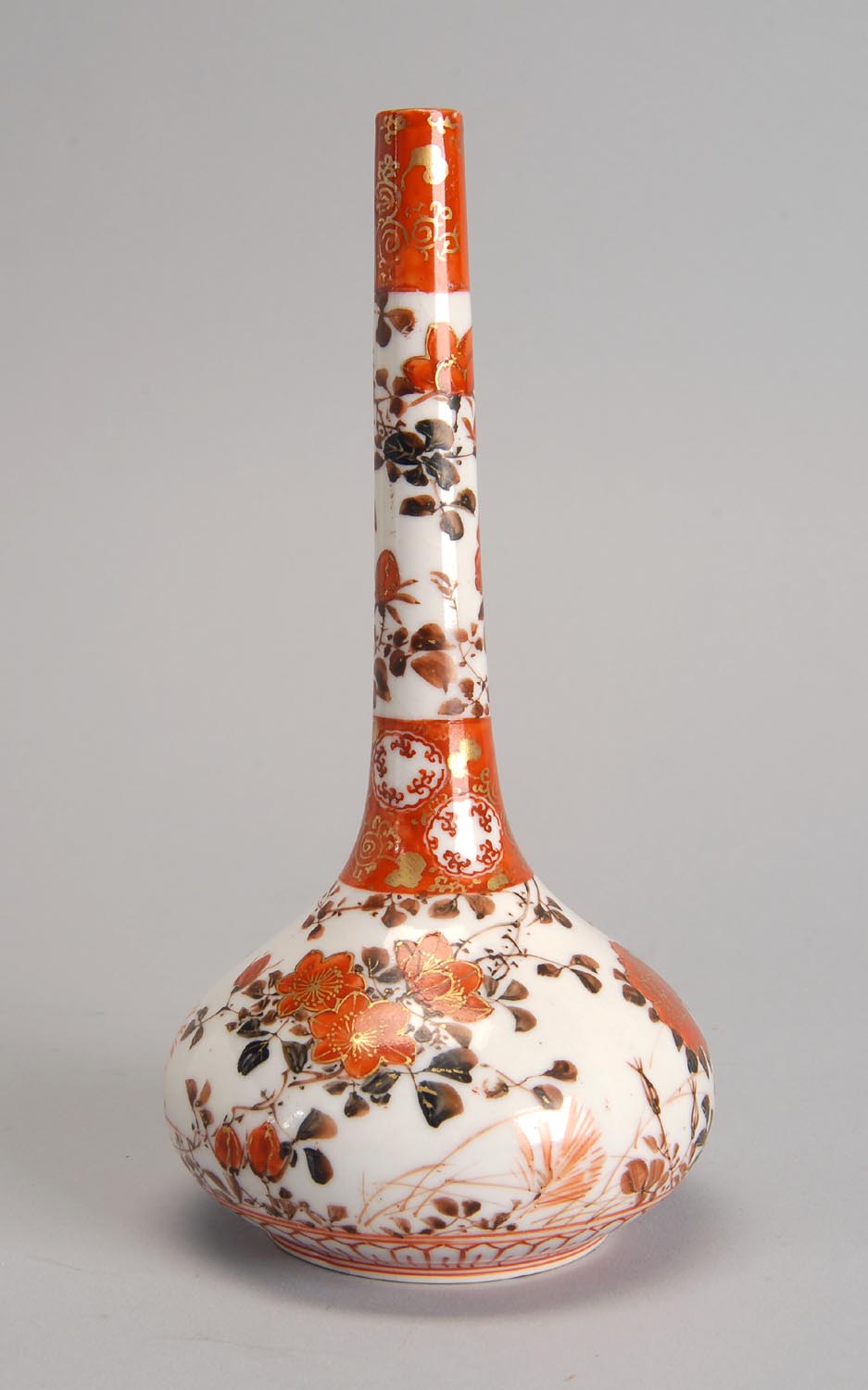 Appraisal: RUST-RED KUTANI PORCELAIN BOTTLE VASE Meiji PeriodIn bladder form with