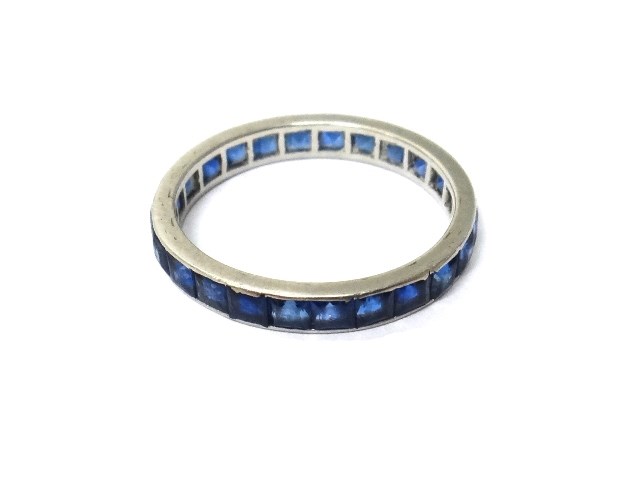 Appraisal: A sapphire set full eternity ring mounted with calibre cut