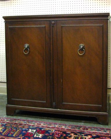 Appraisal: Vintage walnut music cabinet two doors with lion head pulls