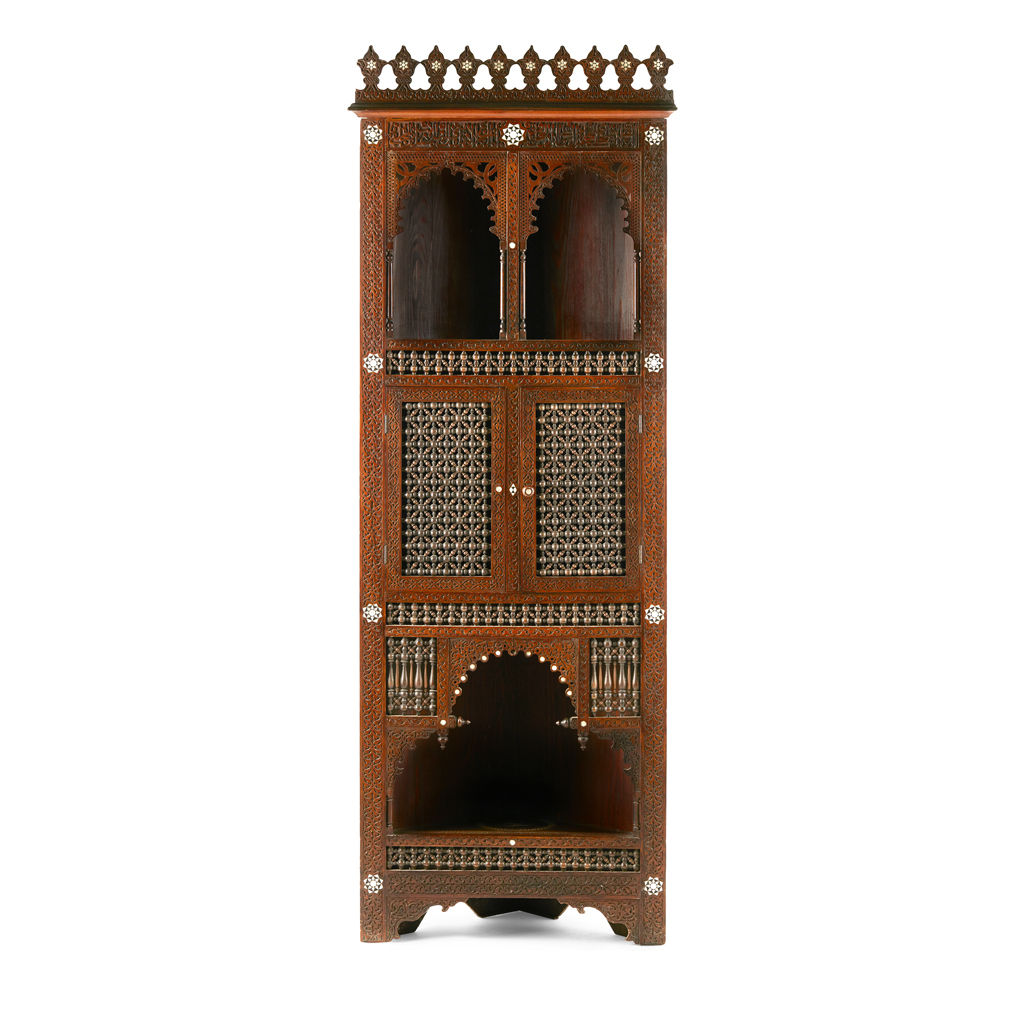 Appraisal: NORTH AFRICAN MOTHER-OF-PEARL INLAID CORNER CABINET the foliate carved cornice