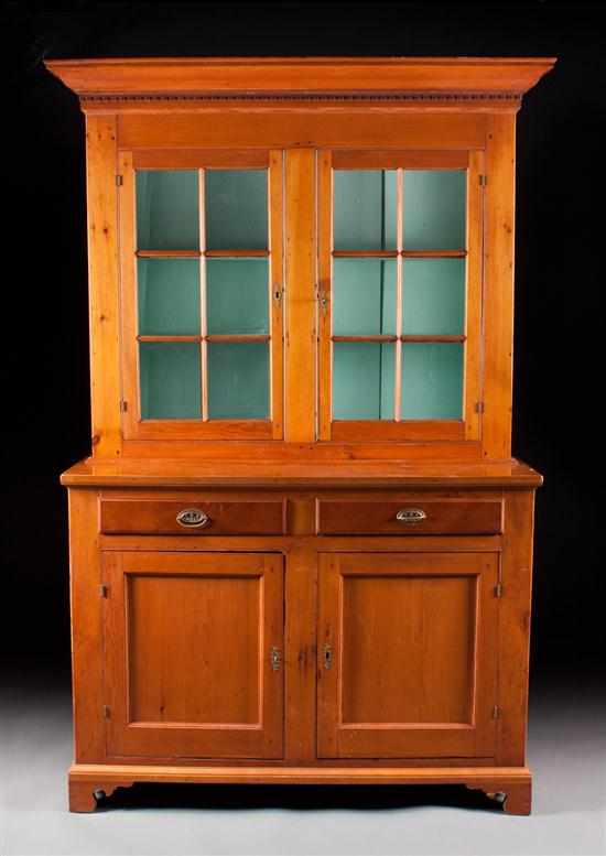 Appraisal: American vernacular pine glazed panel door step-back cupboard circa molded