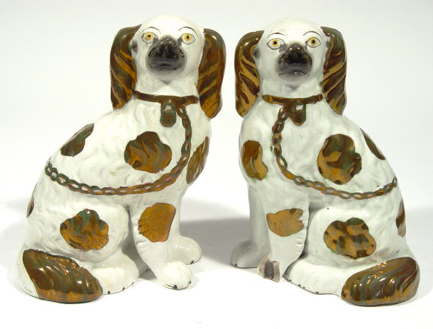 Appraisal: Pair of Victorian Staffordshire spaniels with gold decoration and separate