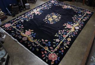 Appraisal: Chinese Art Deco style floral rug with black ground '