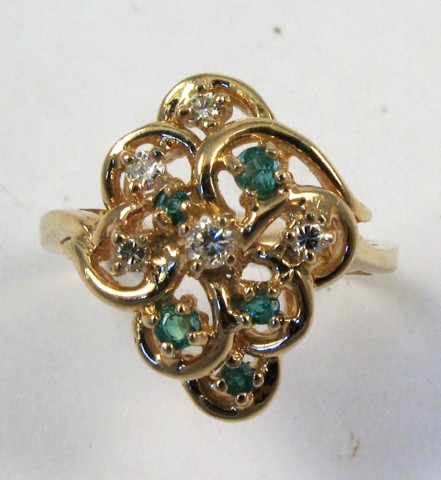 Appraisal: EMERALD DIAMOND AND FOURTEEN KARAT GOLD RING set with five