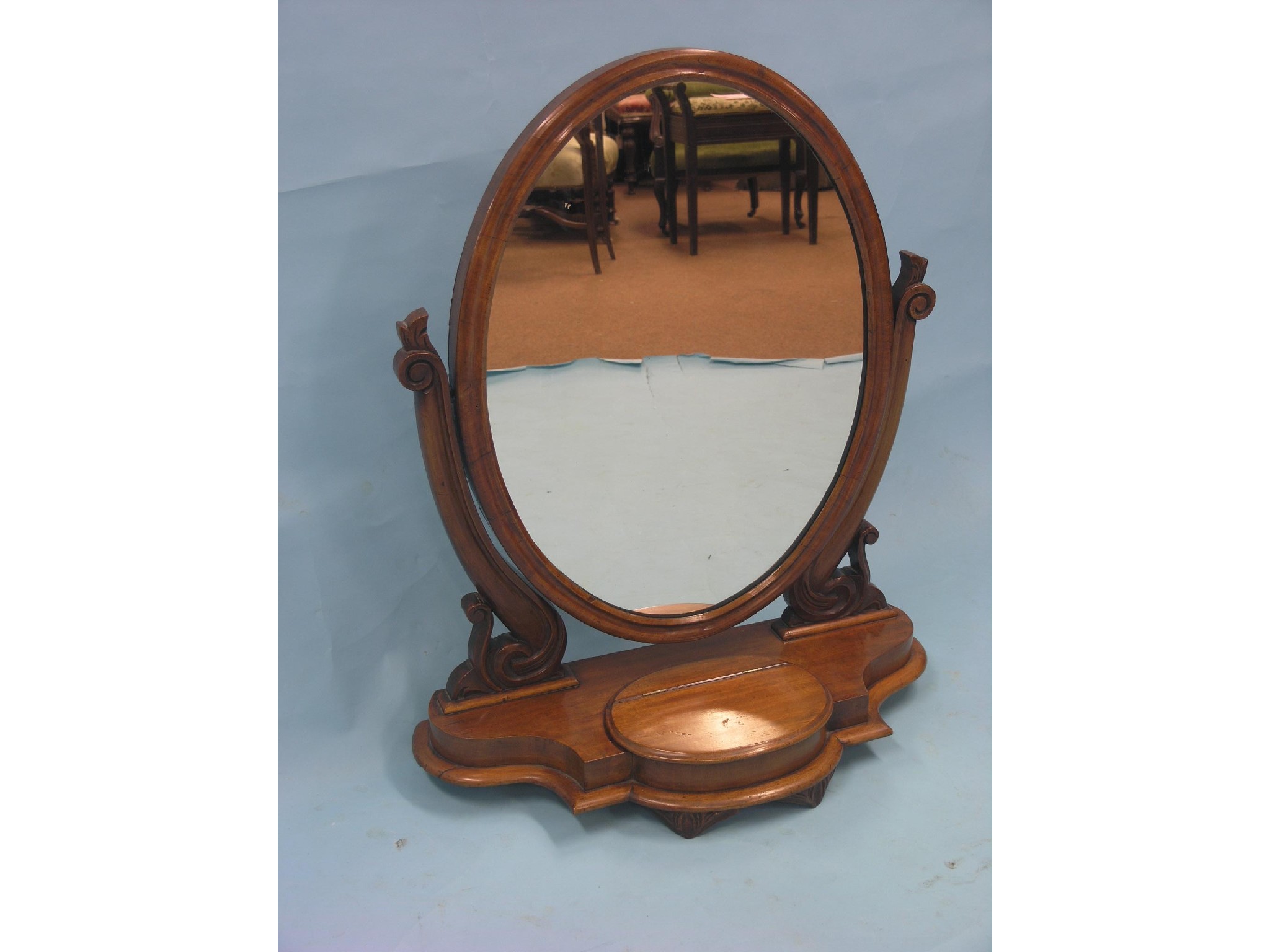 Appraisal: A Victorian mahogany toilet mirror large oval plate adjustable on