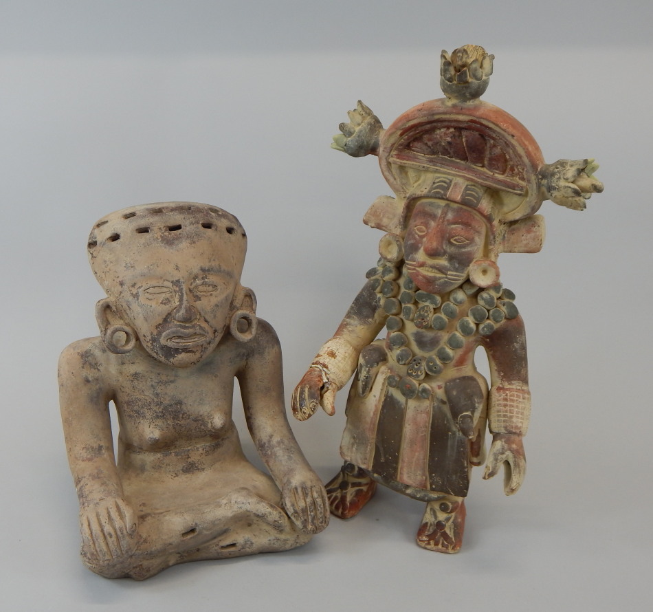 Appraisal: Two reproduction pre Columbian or Mexican type figures one standing