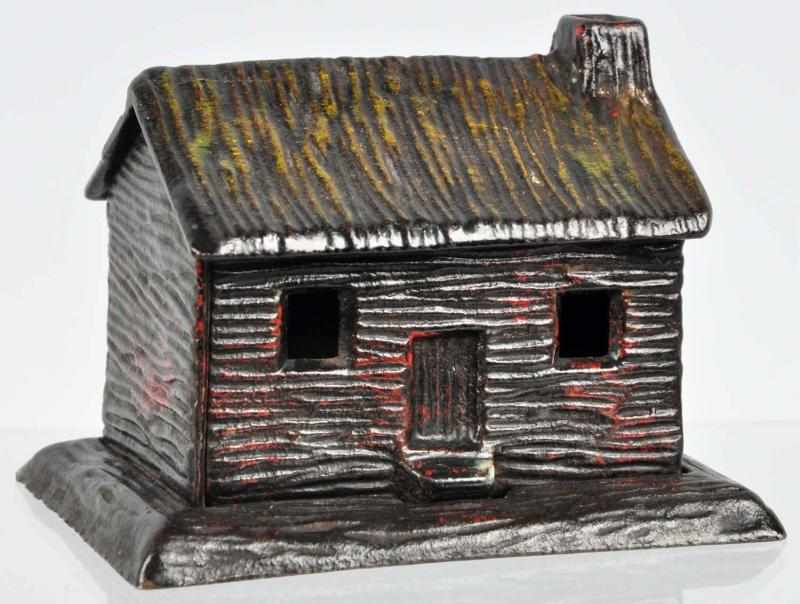 Appraisal: Cast Iron Log Cabin Still Bank Condition Near Mint Size