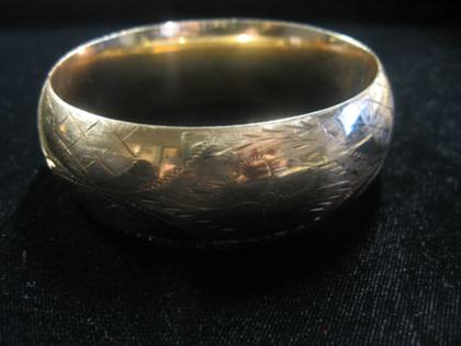 Appraisal: karat yellow gold wide bangle th century Floral etched L