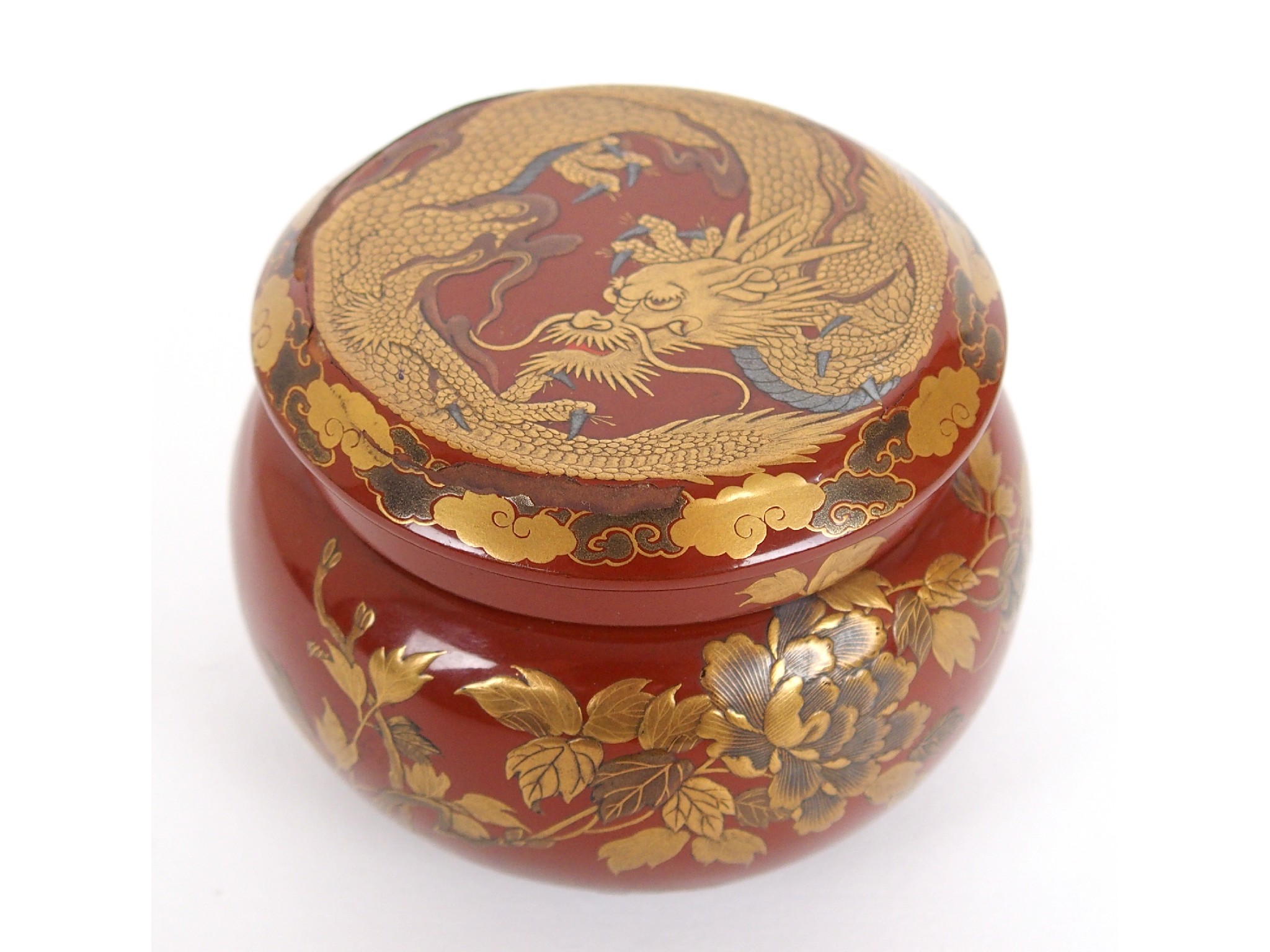 Appraisal: A Japanese red and gold lacquer circular box cover and