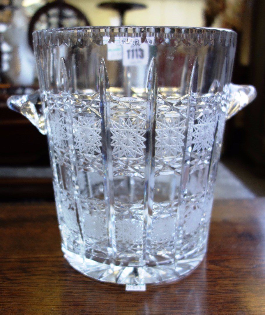 Appraisal: A pair of etched glass ice buckets with stellar decoration