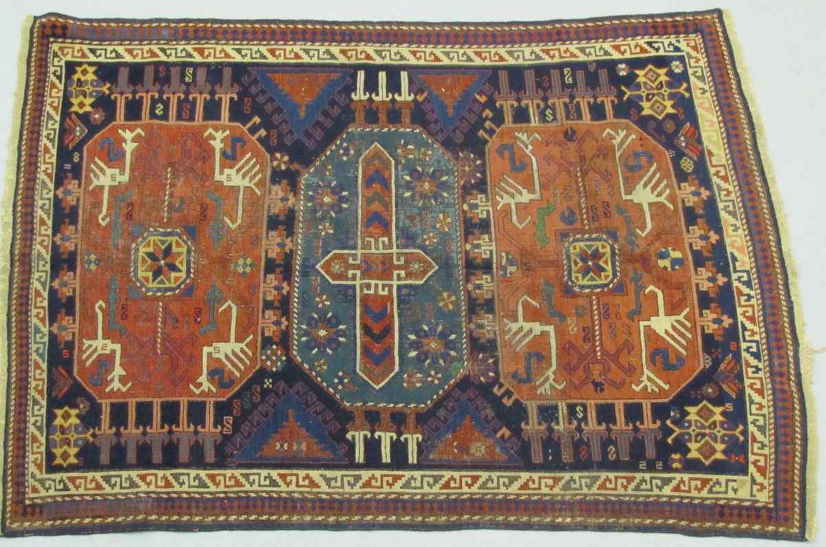 Appraisal: ORIENTAL RUG KAZAK ' x ' '' Three rust-red and