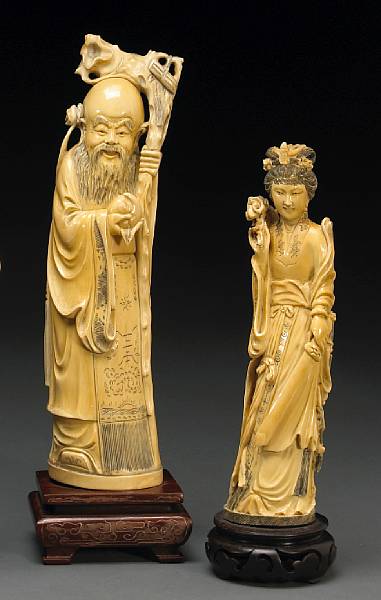 Appraisal: Two tinted ivory figures th Century The taller figure depicting