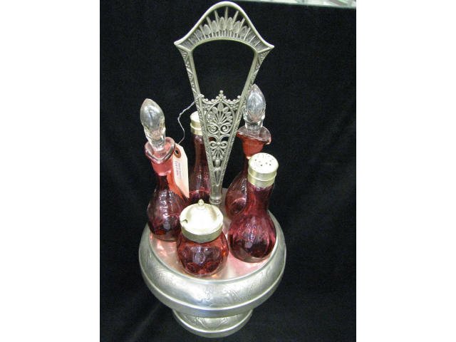 Appraisal: Cranberry Glass Castor Set bottles in silverplate holder