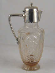 Appraisal: A late Victorian silver mounted cut glass claret jug by