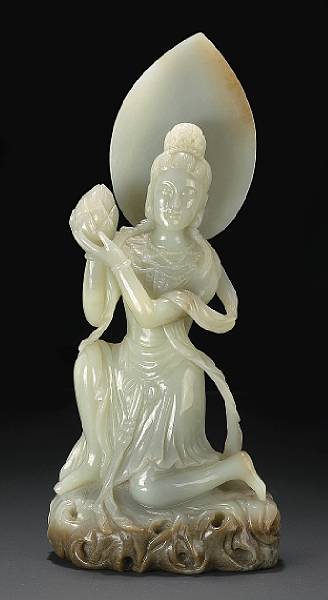 Appraisal: A mottled light green nephrite kneeling Buddhist figure th Century