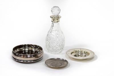 Appraisal: A small silver mounted decanter a silver wine coaster and