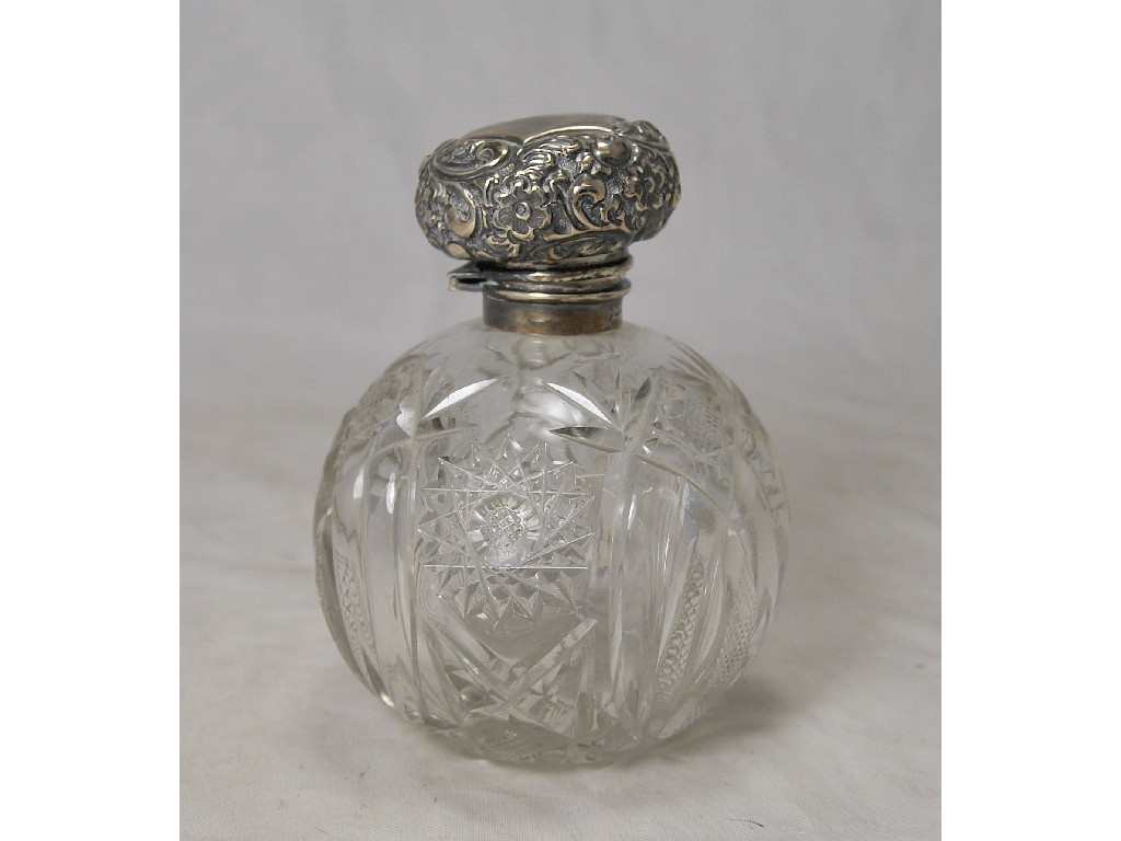 Appraisal: An Edwardian silver topped globular cut glass scent bottle c