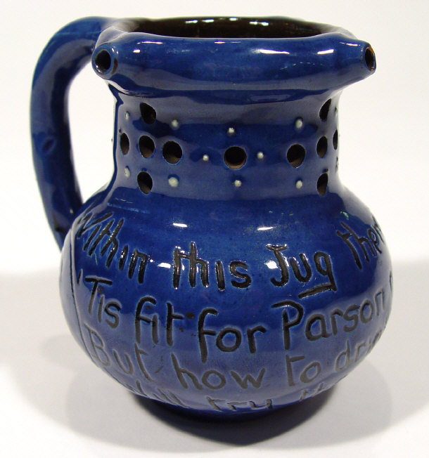 Appraisal: C H Brannam Barum pottery puzzle jug with incised script