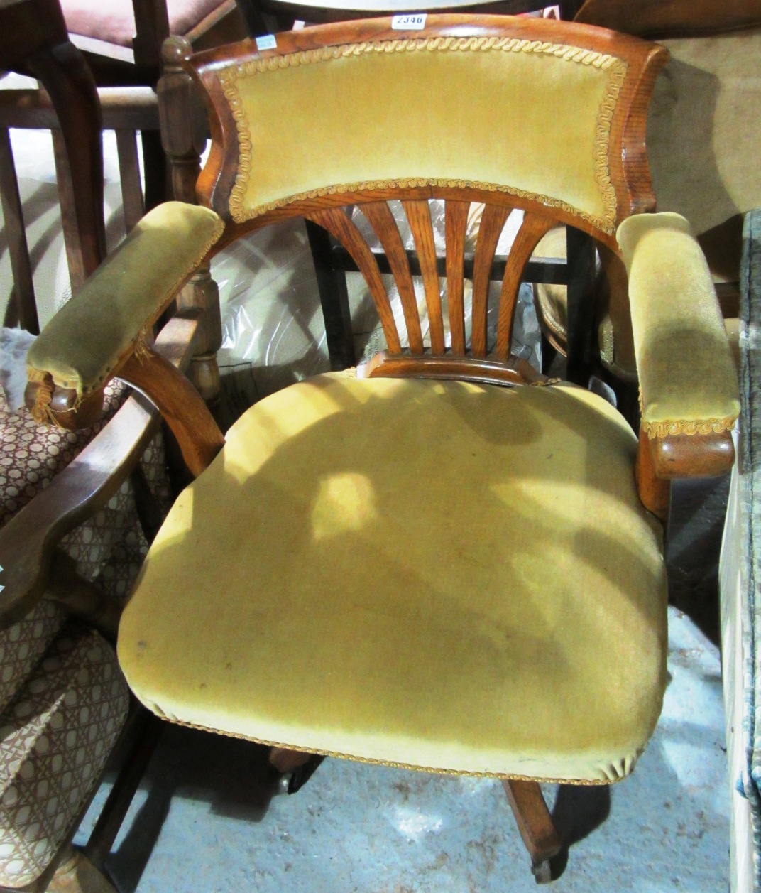 Appraisal: A th century oak swivel office chair