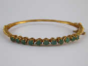 Appraisal: A carat gold emerald bracelet emeralds approx mm diameter internal