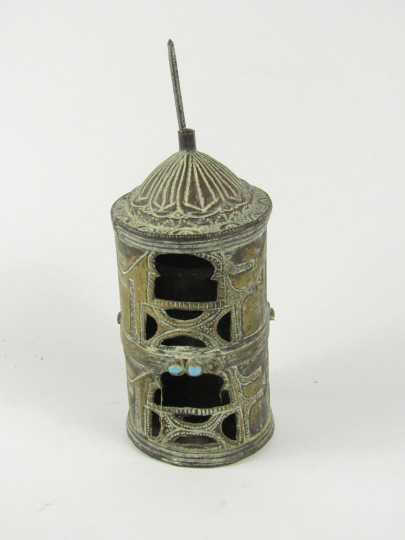 Appraisal: A Tibetan brass prayer wheel containing prayer cast with bands