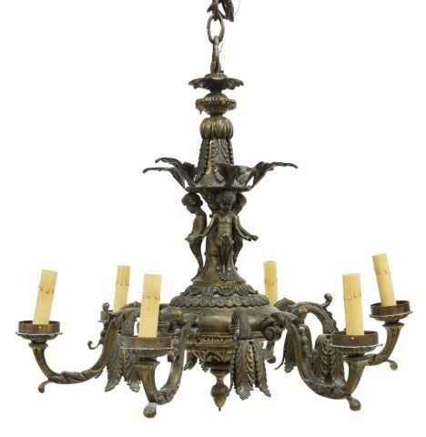 Appraisal: Continental patinated bronze twelve-light chandelier single standard with foliate and