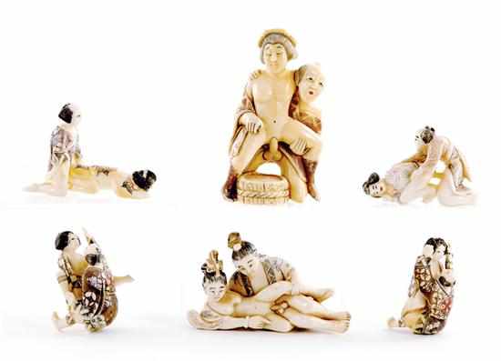 Appraisal: Japanese carved ivory erotic okimono and netsuke group polychrome figures