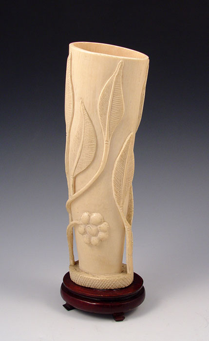 Appraisal: CARVED IVORY TUSK Carved floral design with openwork branches Mounted