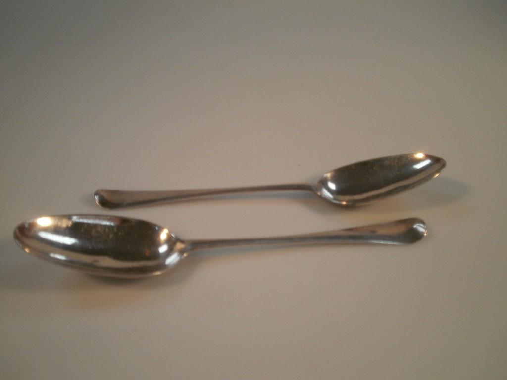 Appraisal: A pair of Georgian silver Old English pattern table spoons